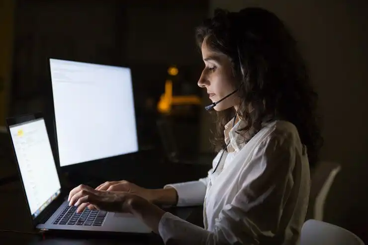 focused businesswoman headset using laptop 74855 2771 optimized